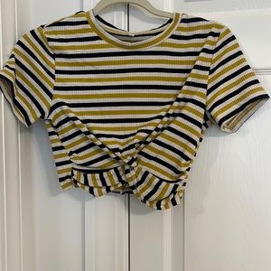 Striped crop top with super cute knot at the front. Stretches! Size small.